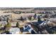 Aerial view of a quiet neighborhood featuring a blue home with solar panels at 1265 Iris Ct, Highlands Ranch, CO 80126