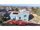 Backyard view featuring a spacious wooden deck, a well kept lawn, and solar panels at 1265 Iris Ct, Highlands Ranch, CO 80126
