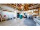 Spacious garage with exposed beams and ample storage space perfect for projects at 1265 Iris Ct, Highlands Ranch, CO 80126