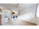 A laundry room is tucked next to this bedroom space complete with white paint and carpet at 1265 Iris Ct, Highlands Ranch, CO 80126
