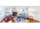 Cozy living room features a fireplace, comfortable seating, and hardwood floors at 1265 Iris Ct, Highlands Ranch, CO 80126