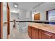 Bright bathroom with ceramic tile, tub and shower, and a wooden vanity at 3145 S Bryant St, Englewood, CO 80110