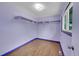 Clean bedroom featuring hardwood floors, ample natural light, and closet at 3145 S Bryant St, Englewood, CO 80110