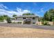 Charming single-story home featuring a cozy front porch, solar panels and a well-maintained lawn at 3145 S Bryant St, Englewood, CO 80110