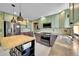 Modern kitchen featuring stainless steel appliances, tile backsplash, and an island, great for cooking at 3145 S Bryant St, Englewood, CO 80110