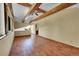 Spacious living room with wood beam ceiling and flooring at 3145 S Bryant St, Englewood, CO 80110