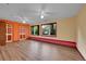 Bright living room with hardwood floors, large windows, and two ceiling fans at 3145 S Bryant St, Englewood, CO 80110