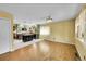 Bright and airy living room with hardwood floors, leading into a kitchen with stylish island at 3145 S Bryant St, Englewood, CO 80110