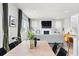 Bright living room area, with open concept design, large windows, and modern furnishings at 17949 W 94Th Dr, Arvada, CO 80007