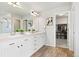 Spacious main bathroom featuring double sinks and a walk-in closet at 17949 W 94Th Dr, Arvada, CO 80007