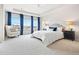 Light-filled main bedroom featuring plush carpeting, large windows and ample space at 17949 W 94Th Dr, Arvada, CO 80007