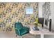 Vibrant home office with floral wallpaper and modern desk setup at 17949 W 94Th Dr, Arvada, CO 80007