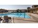 A long, inviting pool with clear blue water and plenty of space for swimming laps on a sunny day at 17949 W 94Th Dr, Arvada, CO 80007