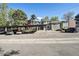 Apartment complex with covered parking and landscaping with a view of the building's exterior at 857 S Van Gordon Ct # B107, Lakewood, CO 80228