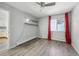 Bedroom featuring bright lighting, a ceiling fan and modern shelving at 857 S Van Gordon Ct # B107, Lakewood, CO 80228