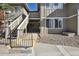 Building exterior with stairs, well-maintained siding, and manicured landscaping showcasing the property at 857 S Van Gordon Ct # B107, Lakewood, CO 80228