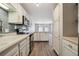Open kitchen design with bright white cabinets and stainless steel appliances at 857 S Van Gordon Ct # B107, Lakewood, CO 80228