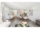 Open-concept living area with dining space flows seamlessly into a modern kitchen with updated appliances at 857 S Van Gordon Ct # B107, Lakewood, CO 80228