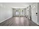 Spacious living room with natural light, hardwood floors, and a welcoming entrance at 857 S Van Gordon Ct # B107, Lakewood, CO 80228