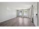 Unfurnished living room featuring modern flooring, bright windows, and a welcoming entrance at 857 S Van Gordon Ct # B107, Lakewood, CO 80228