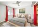 Cozy main bedroom featuring neutral decor, a ceiling fan, and stylish curtains framing the window at 857 S Van Gordon Ct # B107, Lakewood, CO 80228