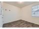 Bedroom with a large window that provides plenty of natural light and vinyl flooring at 1888 Ruby Ct, Brighton, CO 80603