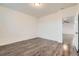 Spacious bedroom with a closet, light walls, and modern hard wood flooring throughout at 1888 Ruby Ct, Brighton, CO 80603