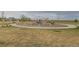 Community playground featuring modern climbing structures and play equipment, enhancing neighborhood recreation at 1888 Ruby Ct, Brighton, CO 80603