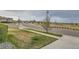 Street view with well-manicured lawns and landscaping, set in a neighborhood with a nearby playground at 1888 Ruby Ct, Brighton, CO 80603