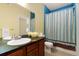 Bathroom with double sinks, granite countertop and shower/tub at 17346 Nature Walk Trl # 108, Parker, CO 80134