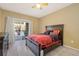 Bright bedroom with a comfortable bed and sliding door to patio at 17346 Nature Walk Trl # 108, Parker, CO 80134