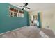 Spacious bedroom with a ceiling fan and private balcony access at 17346 Nature Walk Trl # 108, Parker, CO 80134