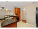Kitchen features granite countertops and dark wood cabinets at 17346 Nature Walk Trl # 108, Parker, CO 80134