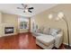 Spacious living room with a fireplace, comfortable seating, and large windows at 17346 Nature Walk Trl # 108, Parker, CO 80134