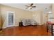 Living room with hardwood floors and access to the kitchen at 17346 Nature Walk Trl # 108, Parker, CO 80134