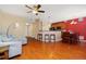 Open concept living and dining area with hardwood floors and kitchen at 17346 Nature Walk Trl # 108, Parker, CO 80134