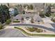 Sprawling single story home with circular driveway, lush landscaping, and mountain views at 2653 S Harrington Ln, Lakewood, CO 80227