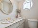 Powder room with decorative sink, lighting, and mirror at 2653 S Harrington Ln, Lakewood, CO 80227