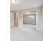 Bright bedroom featuring neutral walls and large mirrored closet at 2653 S Harrington Ln, Lakewood, CO 80227