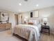 Spacious bedroom with a comfortable bed and neutral walls at 2653 S Harrington Ln, Lakewood, CO 80227