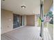 Back deck of home with sliding door access, brick siding, and railing with view of fenced backyard at 2653 S Harrington Ln, Lakewood, CO 80227