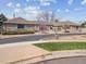 Charming brick home featuring mature landscaping and circular driveway at 2653 S Harrington Ln, Lakewood, CO 80227