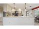 Bright kitchen featuring granite countertops, pendant lights, and modern appliances at 2653 S Harrington Ln, Lakewood, CO 80227