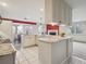 Spacious kitchen with granite countertops, modern appliances, and adjacent dining area at 2653 S Harrington Ln, Lakewood, CO 80227