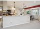 Bright kitchen featuring granite countertops, pendant lights, and modern appliances at 2653 S Harrington Ln, Lakewood, CO 80227