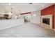 Open concept living room featuring a kitchen, fireplace, and dining area at 2653 S Harrington Ln, Lakewood, CO 80227