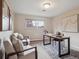 Bright room with 2 chairs and a desk at 2653 S Harrington Ln, Lakewood, CO 80227