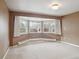 Cozy living room with neutral carpet and a large bay window, offering ample natural light at 2653 S Harrington Ln, Lakewood, CO 80227