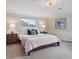 Comfortable bedroom featuring a large window, and soft carpet at 2653 S Harrington Ln, Lakewood, CO 80227