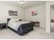 Comfortable bedroom with neutral carpet, modern decor, and decorative wall art at 16002 E 111Th Cir, Commerce City, CO 80022